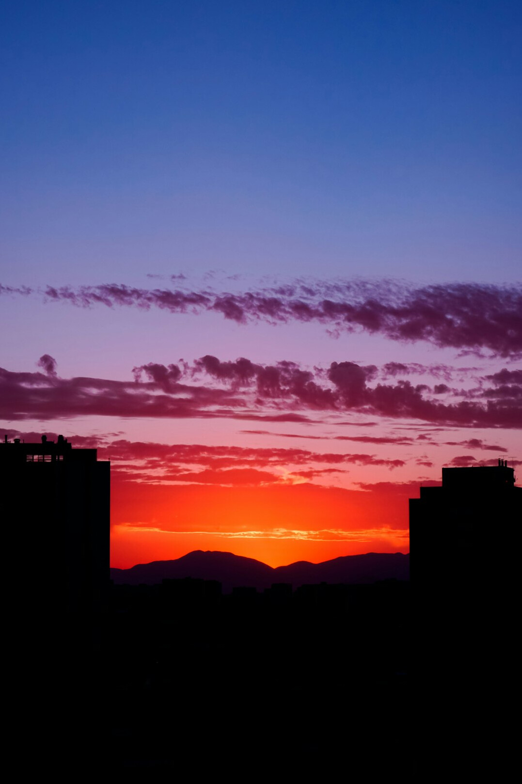 View of Santiago de Chile skyline with the Andes mountains at sunset